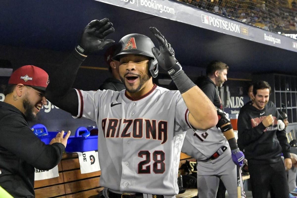 Oct 7, 2023; Los Angeles, California, USA; Arizona Diamondbacks left fielder Tommy Pham (28) reacts in the dug out against the Los Angeles Dodgers during the eighth inning for game one of the NLDS for the 2023 MLB playoffs at Dodger Stadium.