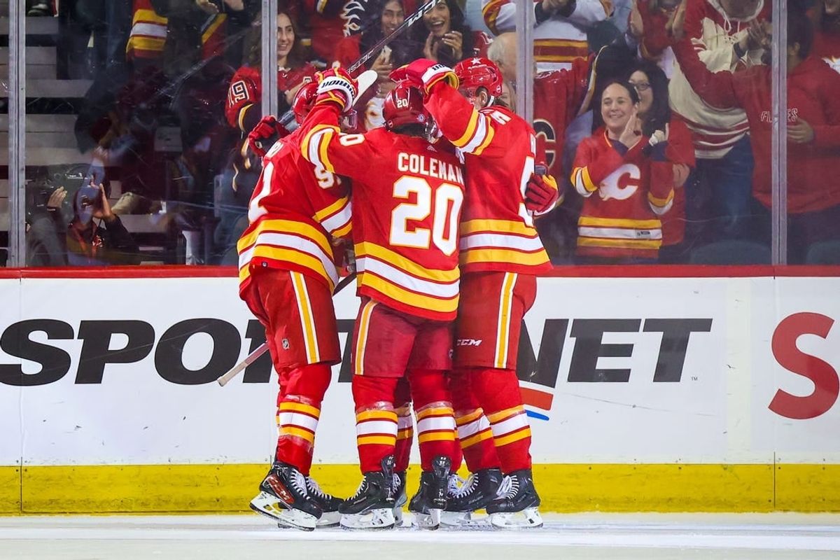 Jan 9, 2024; Calgary, Alberta, CAN; Calgary Flames center Blake Coleman (20) celebrates his goal with teammates against the Ottawa Senators during the third period at Scotiabank Saddledome.