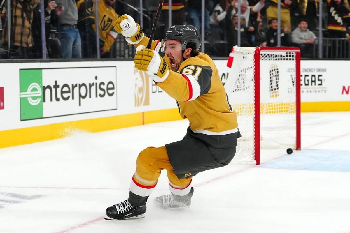 Dec 12, 2023; Las Vegas, Nevada, USA; Vegas Golden Knights right wing Mark Stone (61) celebrates after scoring a goal against Calgary Flames goaltender Dustin Wolf (32) during an overtime period to give the Golden Knights a 5-4 victory at T-Mobile Arena.