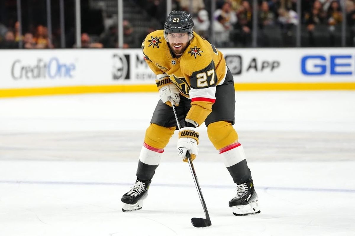 Oct 17, 2023; Las Vegas, Nevada, USA; Vegas Golden Knights defenseman Shea Theodore (27) prepares for a face off against the Dallas Stars during the third period at T-Mobile Arena.