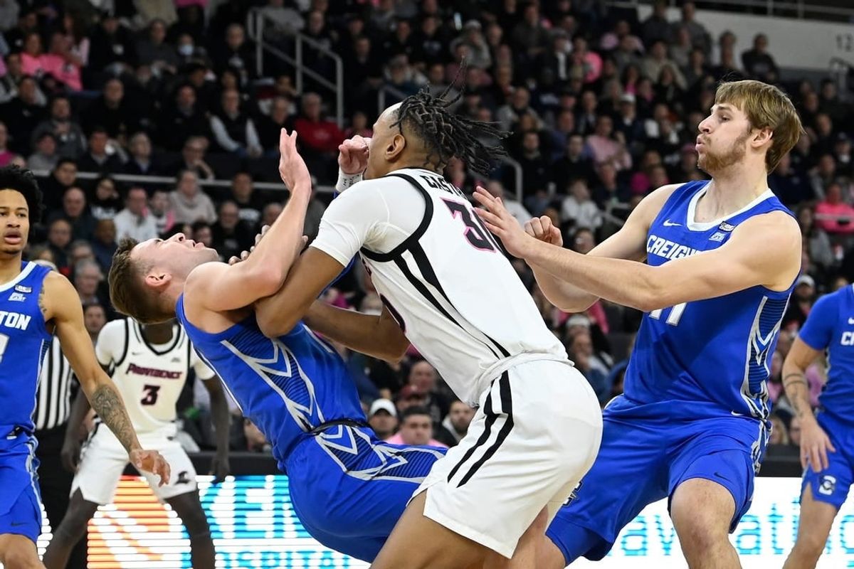 Feb 7, 2024; Providence, Rhode Island, USA; Creighton Bluejays guard Steven Ashworth (1)  is folded by Providence Friars forward Rafael Castro (30) during the first half at Amica Mutual Pavilion.