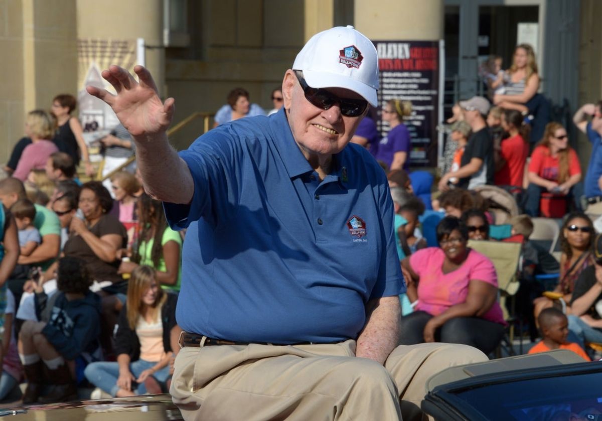 Aug 2, 2014; Canton, OH, USA; Sonny Jurgensen waves to the crowd at the TimkenSteel Grand Parade on Cleveland Avenue in advance of the 2014 Pro Football Hall of Fame Enshrinement. Mandatory Credit: Kirby Lee-Imagn Images