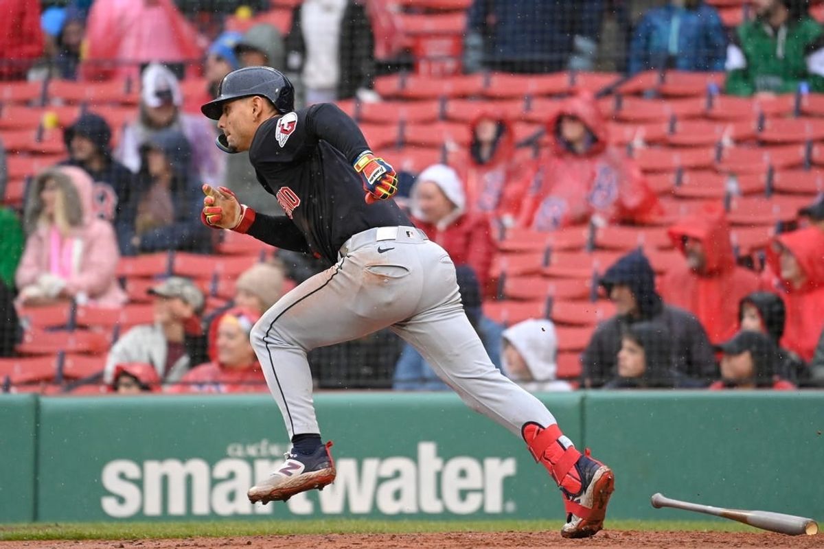 Apr 18, 2024; Boston, Massachusetts, USA; Cleveland Guardians second baseman Andres Gimenez (0) runs to first base during the ninth inning against the Boston Red Sox at Fenway Park.