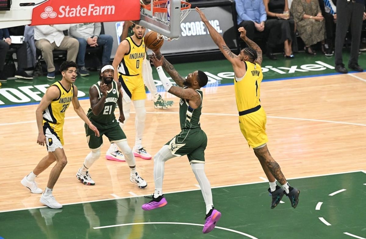 Apr 23, 2024; Milwaukee, Wisconsin, USA;Milwaukee Bucks guard Damian Lillard (0) drives to the basket against Indiana Pacers forward Obi Toppin (1) in the first half during game two of the first round for the 2024 NBA playoffs at Fiserv Forum.