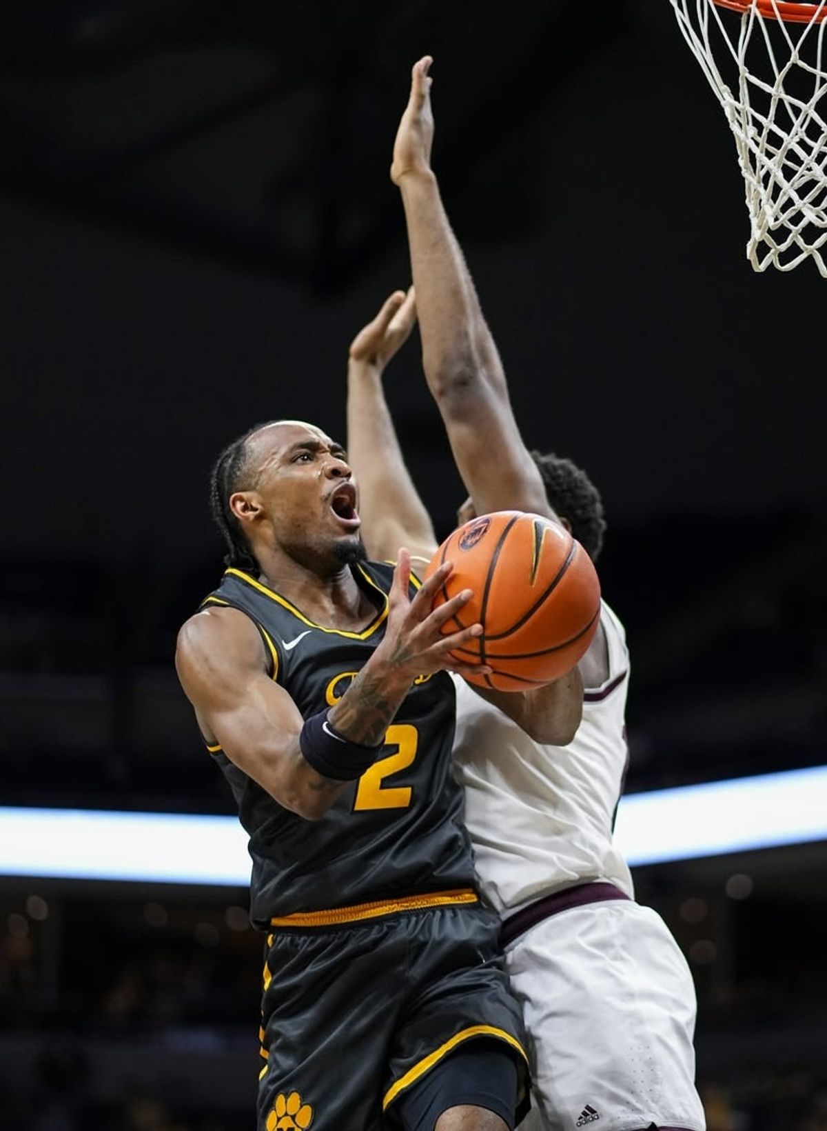 Feb 7, 2024; Columbia, Missouri, USA; Missouri Tigers guard Tamar Bates (2) goes up for a shot against Texas A&M Aggies forward Wildens Leveque (10) during the first half at Mizzou Arena.