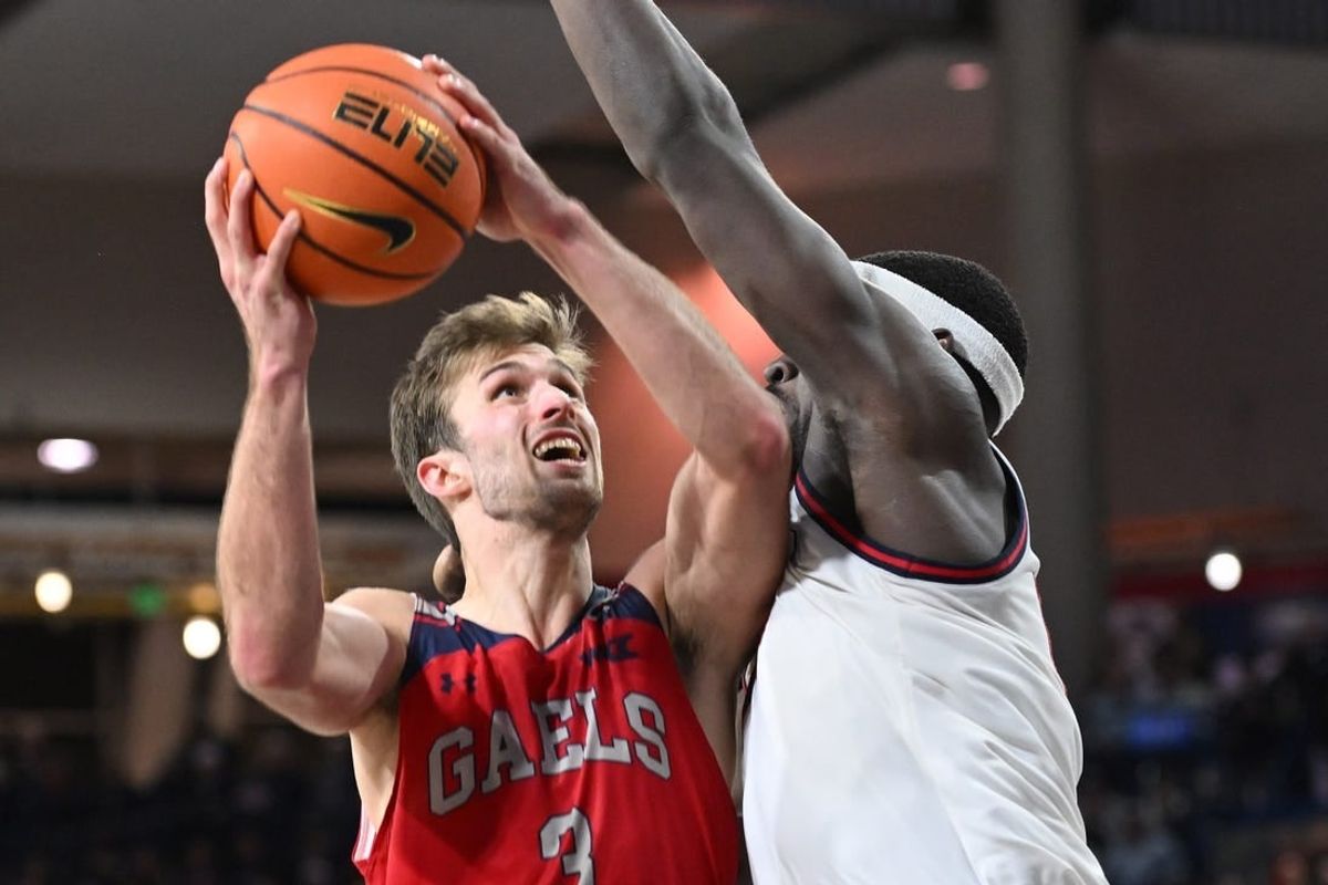 Feb 3, 2024; Spokane, Washington, USA; St. Mary's Gaels guard Augustas Marciulionis (3) shoots the ball against Gonzaga Bulldogs forward Graham Ike (13) in the second half at McCarthey Athletic Center. St. Mary's Gaels won 64-62.