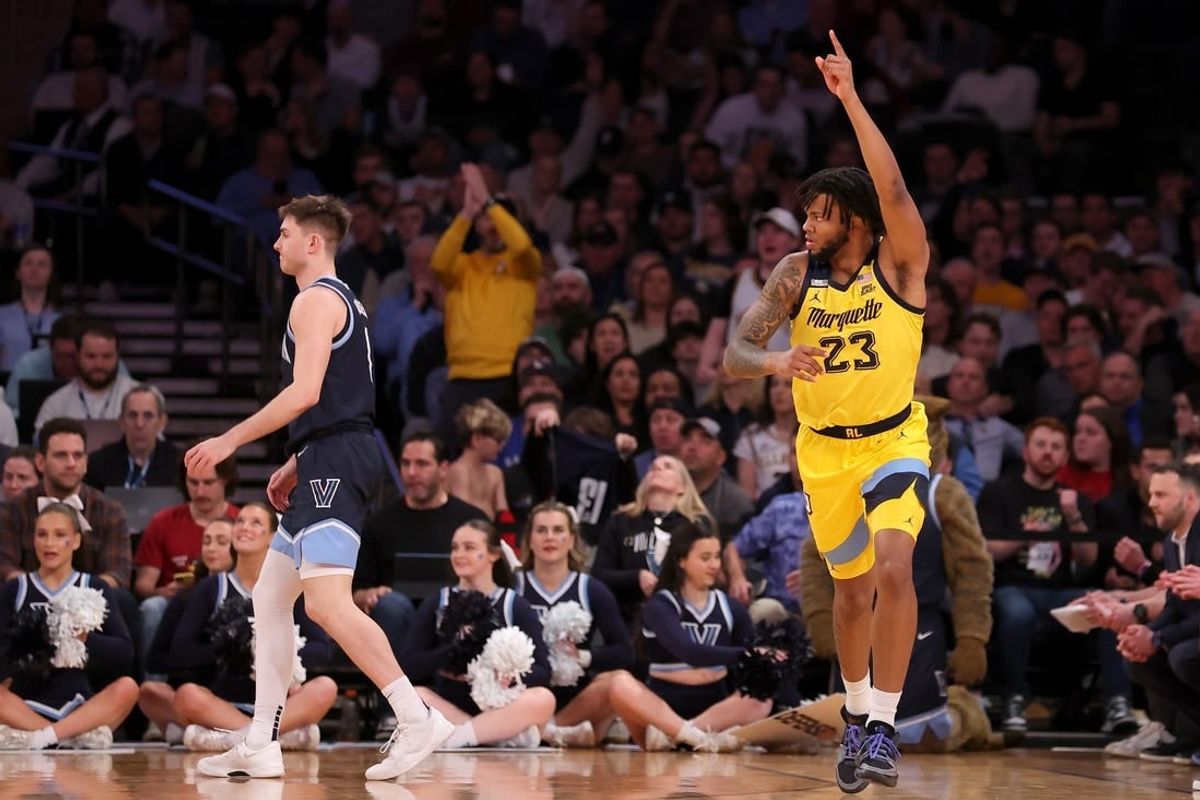 Mar 14, 2024; New York City, NY, USA; Marquette Golden Eagles forward David Joplin (23) celebrates his three point shot against Villanova Wildcats guard Brendan Hausen (1) during the first half at Madison Square Garden.