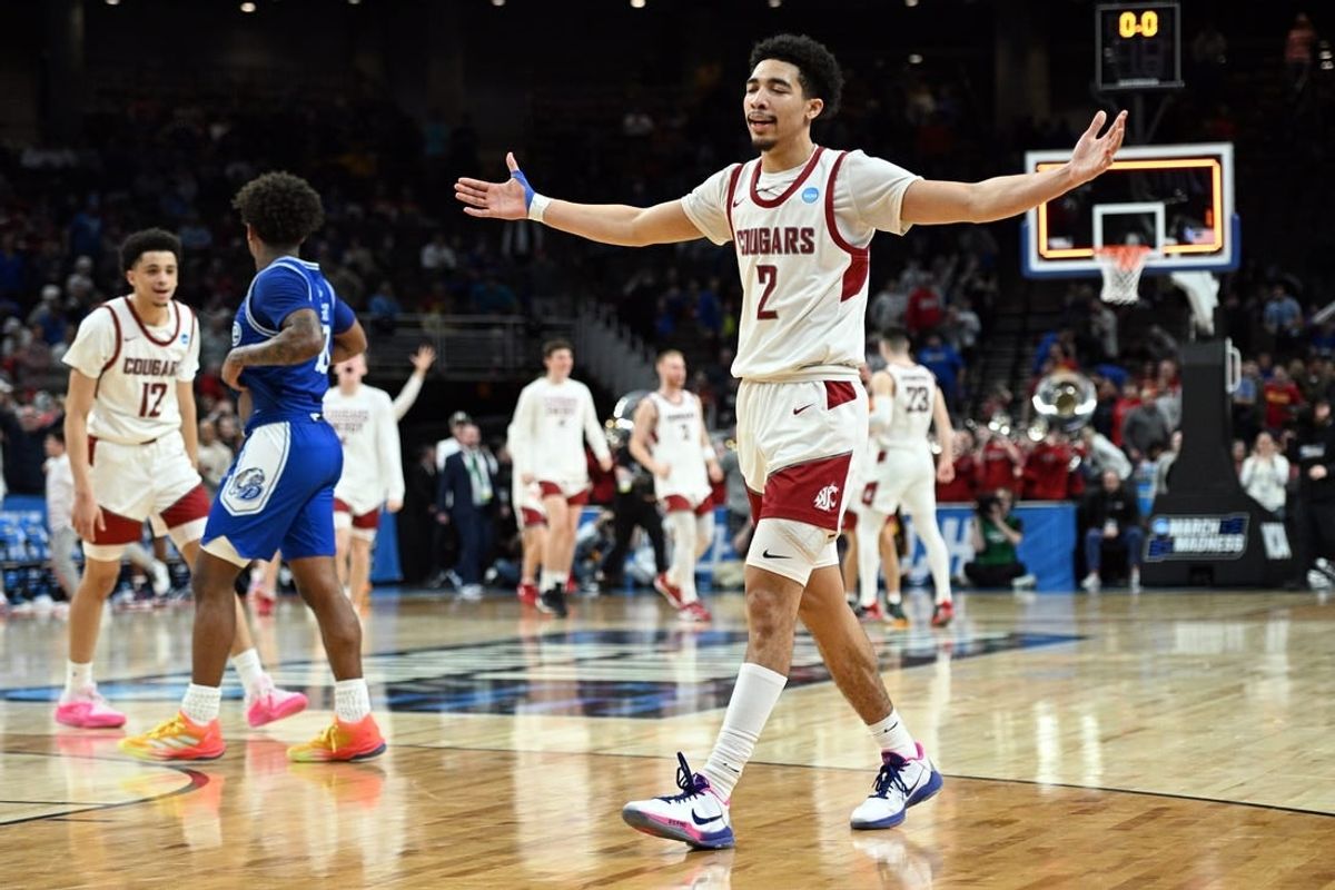 Mar 21, 2024; Omaha, NE, USA; Washington State Cougars guard Myles Rice (2) celebrates after defeating the Drake Bulldogs in the first round of the 2024 NCAA Tournament at CHI Health Center Omaha.
