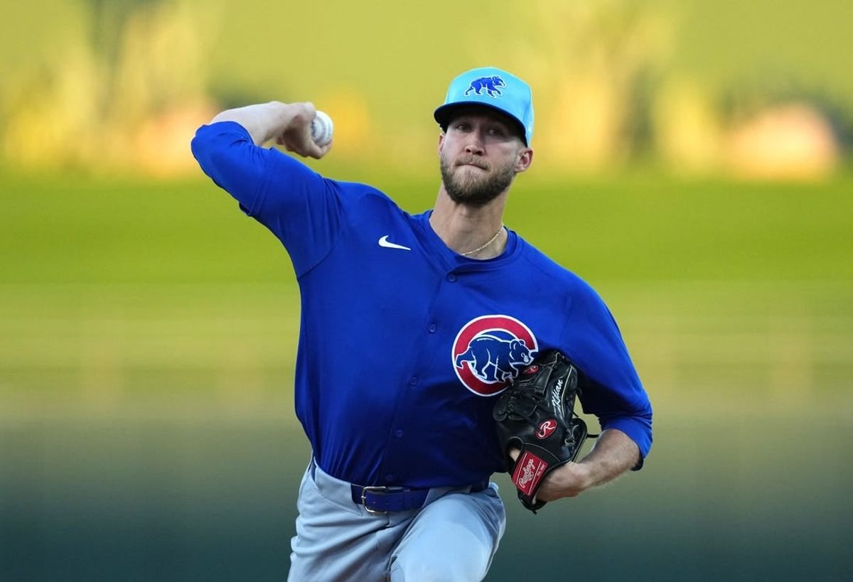Mar 5, 2024; Surprise, Arizona, USA; Chicago Cubs starting pitcher Caleb Kilian (45) pitches against the Kansas City Royals during the first inning at Surprise Stadium.