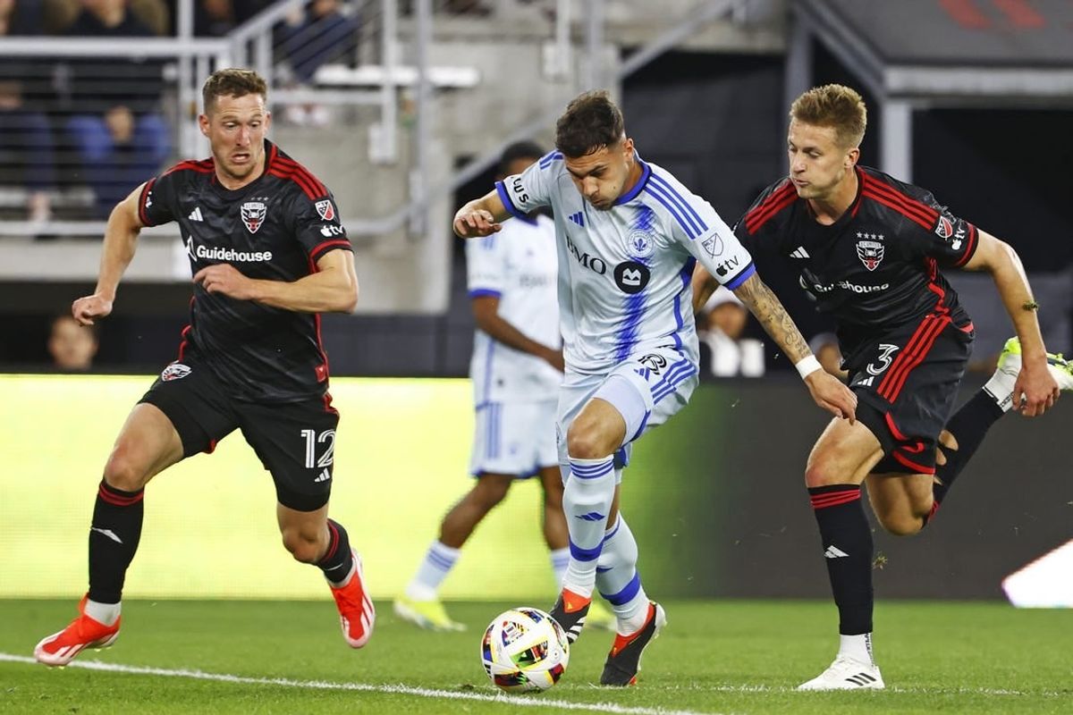Mar 30, 2024; Washington, District of Columbia, USA; CF Montreal midfielder Dominic Iankov (8) runs with the ball as D.C. United defender Conner Antley (12) and D.C. United defender Lucas Bartlett (3) defend during the first half an at Audi Field.