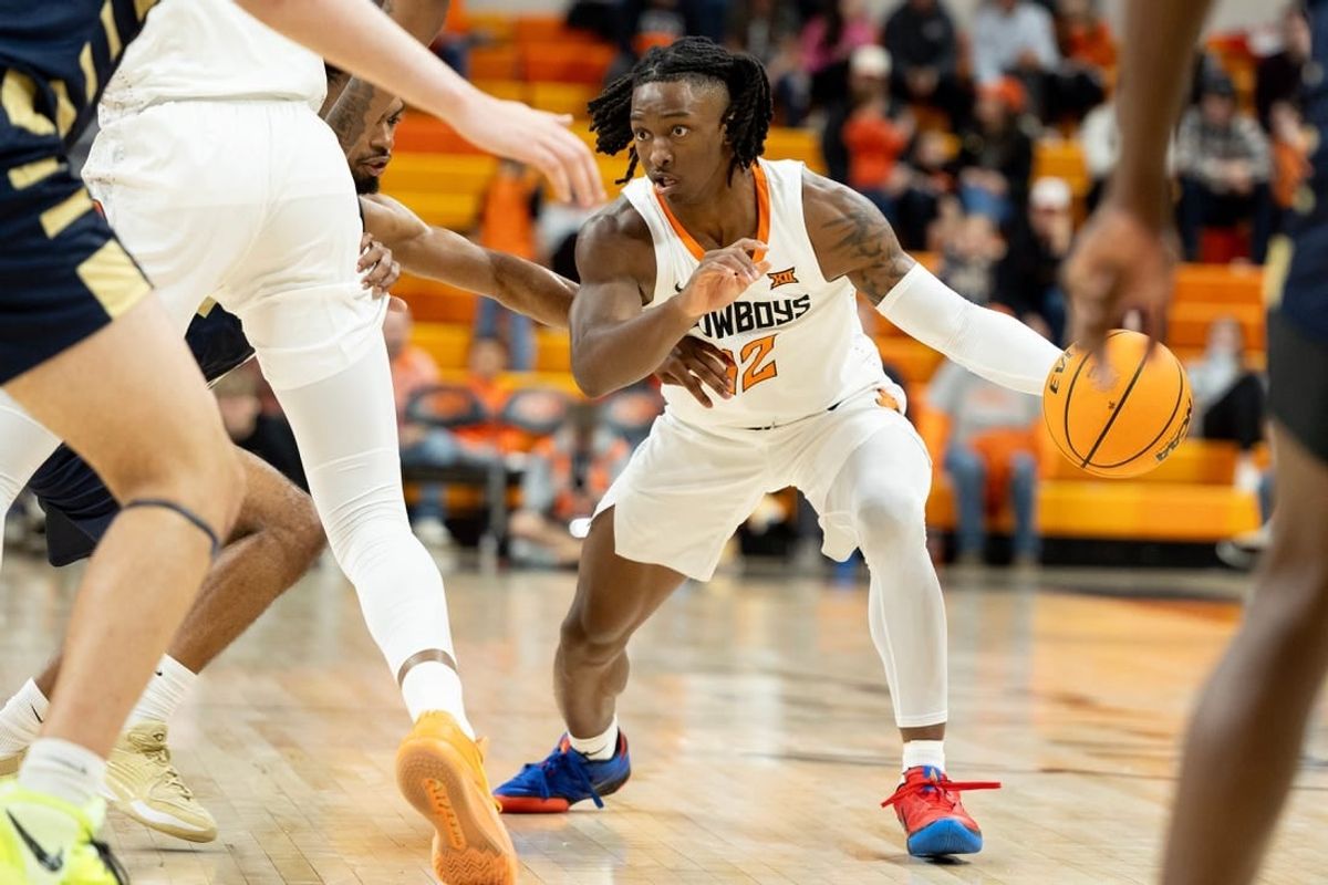 Dec 17, 2023; Stillwater, Okla, USA ; Oklahoma State Cowboys guard Javon Small (12) brings the ball up the court in the first half of an NCAA basketball game against the Oral Roberts Golden Eagles at Gallagher Iba arena.