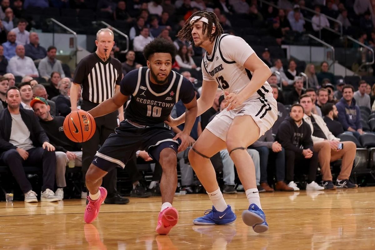Mar 13, 2024; New York City, NY, USA; Georgetown Hoyas guard Jayden Epps (10) drives to the basket against Providence Friars forward Josh Oduro (13) during the first half at Madison Square Garden.