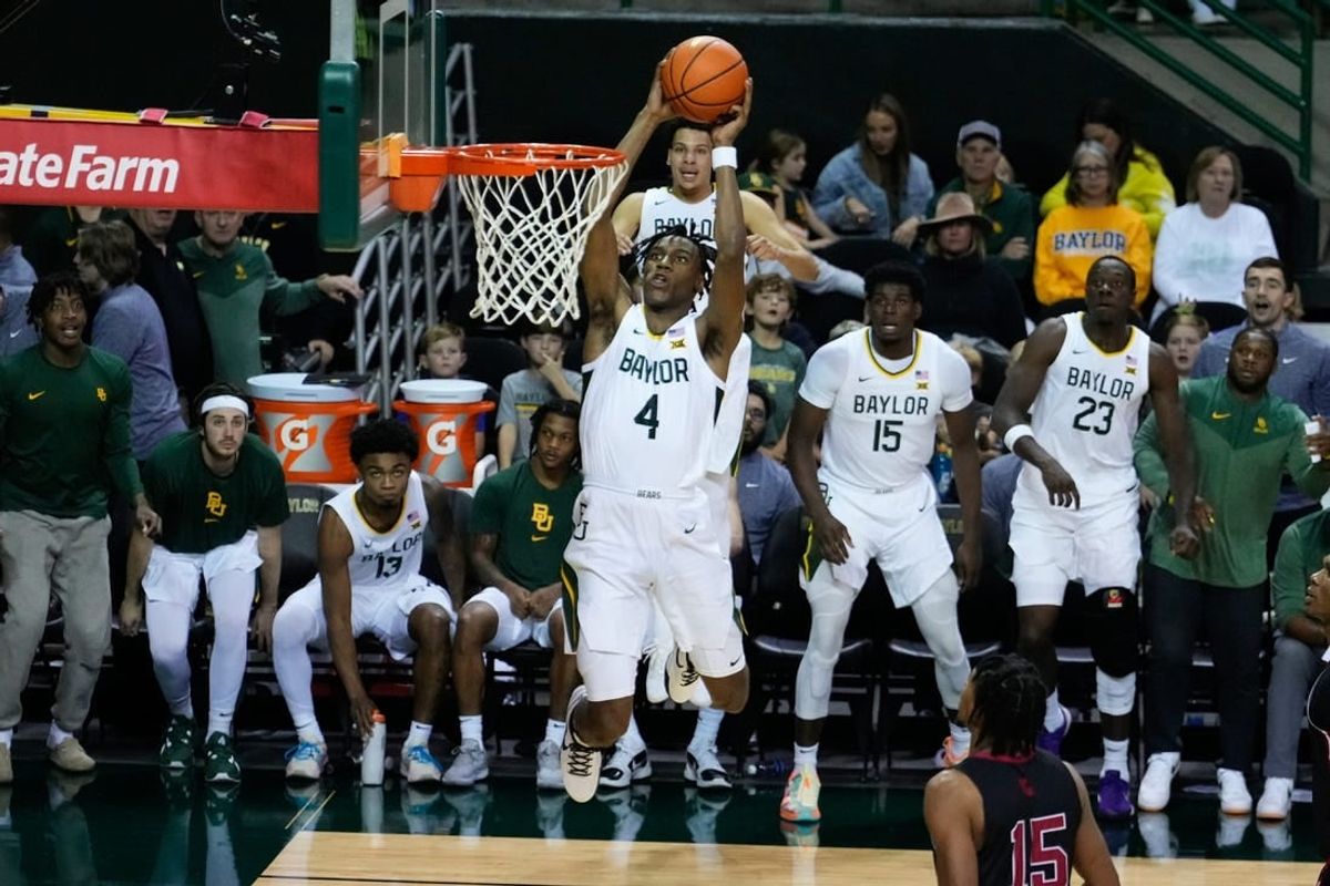 Nov 28, 2023; Waco, Texas, USA;  Baylor Bears guard Ja'Kobe Walter (4) dunks against the Nicholls State Colonels during the second half at Ferrell Center.