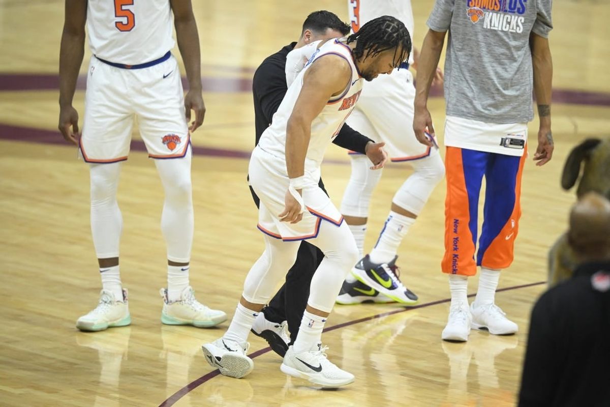 Mar 3, 2024; Cleveland, Ohio, USA; New York Knicks guard Jalen Brunson (11) limps off the court in the first quarter against the Cleveland Cavaliers at Rocket Mortgage FieldHouse.