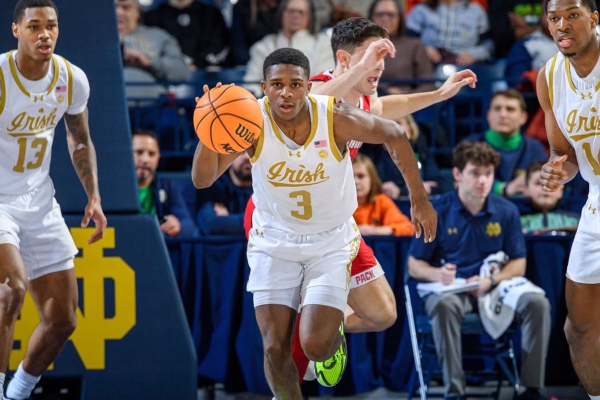 Jan 3, 2024; South Bend, Indiana, USA; Notre Dame Fighting Irish guard Markus Burton (3) dribbles in the first half against the North Carolina State Wolfpack at the Purcell Pavilion.