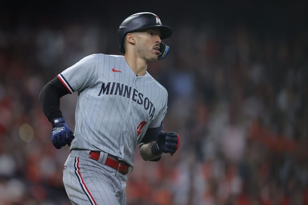 Oct 7, 2023; Houston, Texas, USA; Minnesota Twins shortstop Carlos Correa (4) hits a double in the eighth inning against the Houston Astros during game one of the ALDS for the 2023 MLB playoffs at Minute Maid Park.