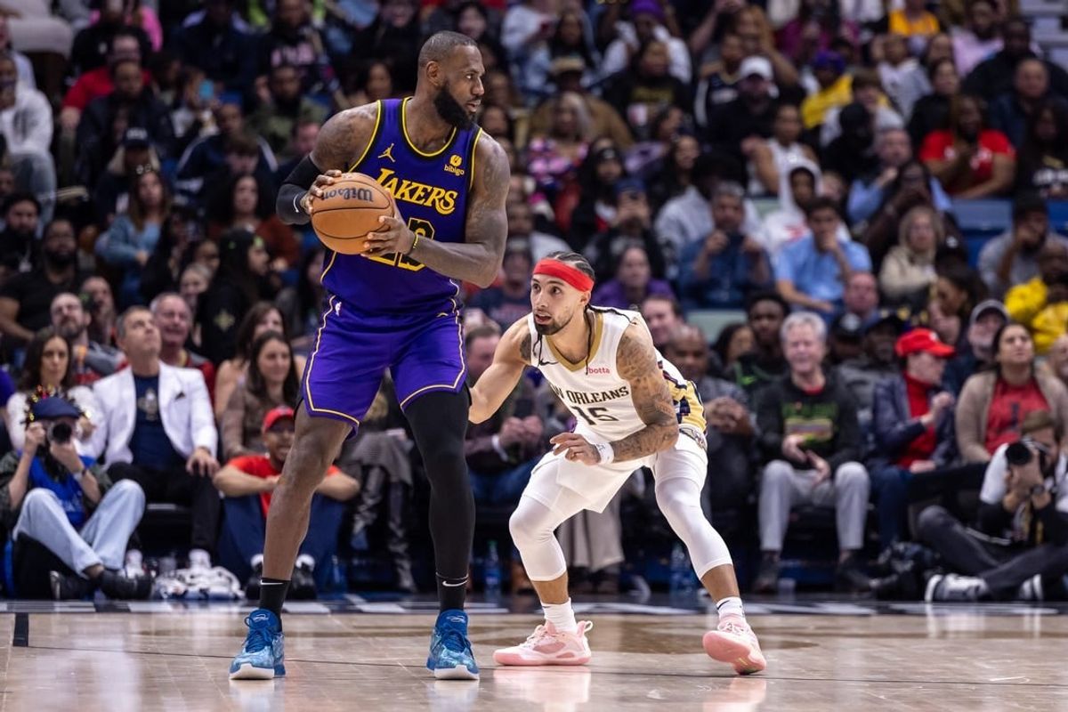 Dec 31, 2023; New Orleans, Louisiana, USA;  New Orleans Pelicans guard Jose Alvarado (15) guards Los Angeles Lakers forward LeBron James (23) during the second half at Smoothie King Center.