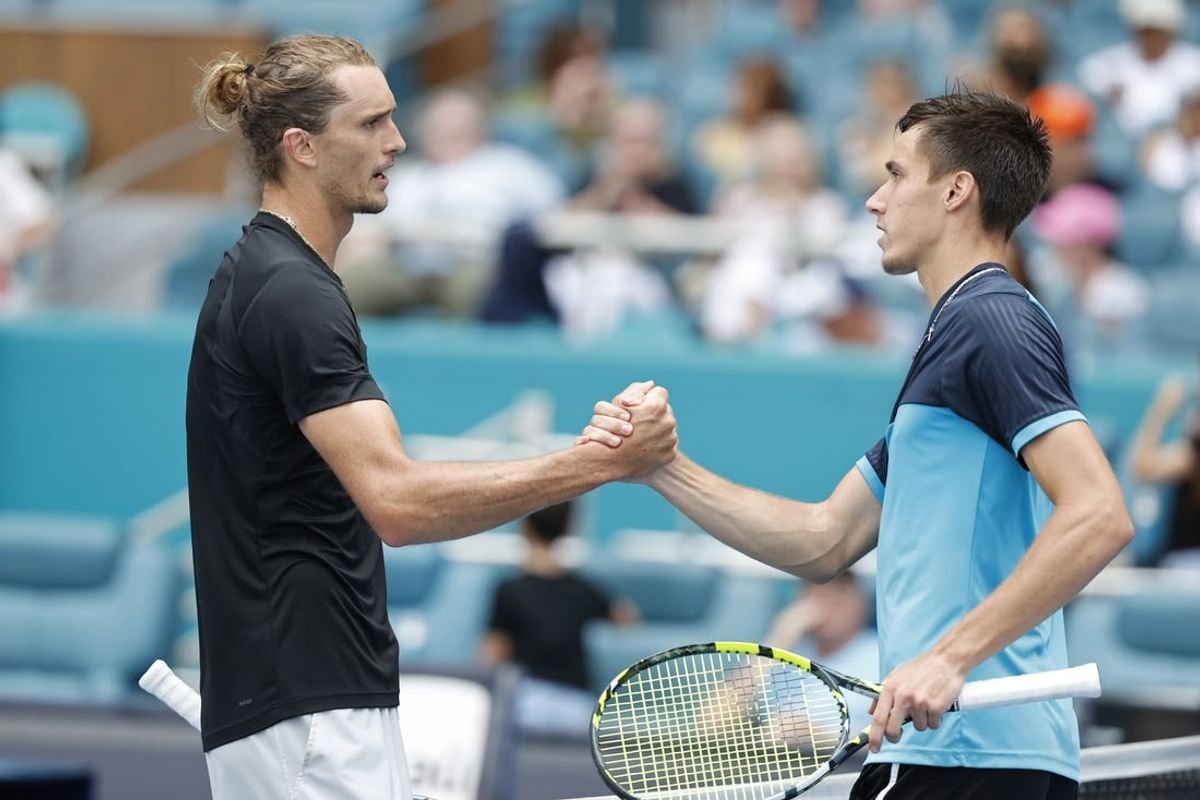 Mar 28, 2024; Miami Gardens, FL, USA; Alexander Zverev (GER) (L) shakes hands with Fabian Marozsan (HUN) (R) after their match on day eleven of the Miami Open at Hard Rock Stadium.