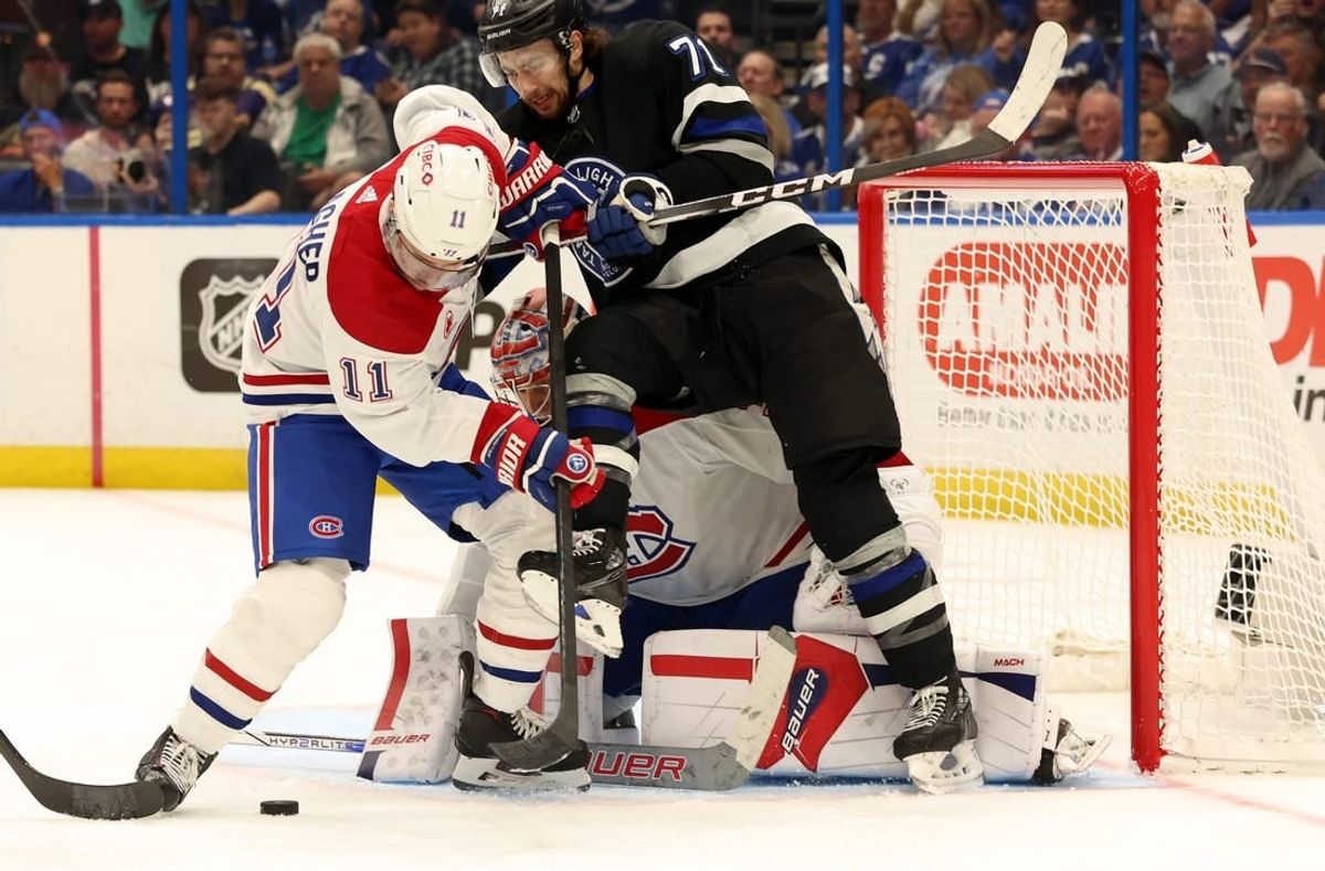 Mar 2, 2024; Tampa, Florida, USA;  Montreal Canadiens right wing Brendan Gallagher (11) and goaltender Cayden Primeau (30) defends Tampa Bay Lightning center Anthony Cirelli (71) during the first period at Amalie Arena.