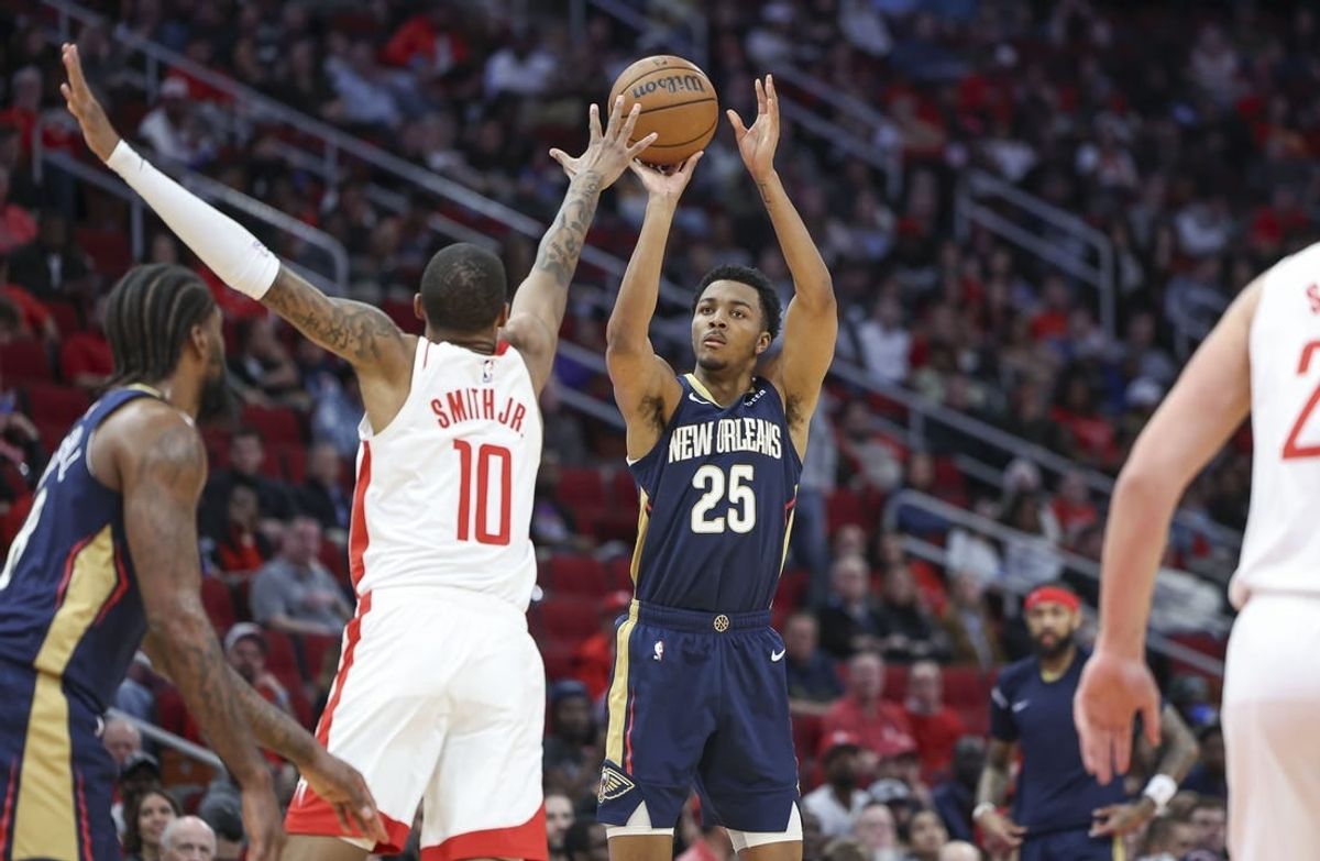 Jan 31, 2024; Houston, Texas, USA; New Orleans Pelicans guard Trey Murphy III (25) shoots the ball as Houston Rockets forward Jabari Smith Jr. (10) defends during the second quarter at Toyota Center.