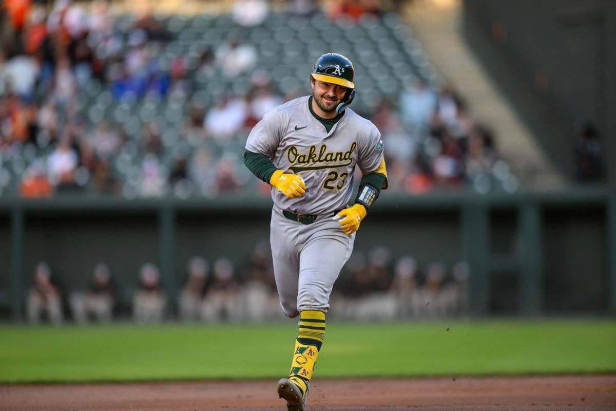 Apr 26, 2024; Baltimore, Maryland, USA; Oakland Athletics catcher Shea Langeliers (23) reacts after hitting a home run during the first inning against the Baltimore Orioles at Oriole Park at Camden Yards.