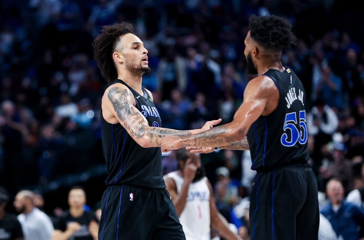 Nov 10, 2023; Dallas, Texas, USA;  Dallas Mavericks forward Derrick Jones Jr. (55) celebrates with Dallas Mavericks center Dereck Lively II (2) during the second half against the LA Clippers at American Airlines Center.