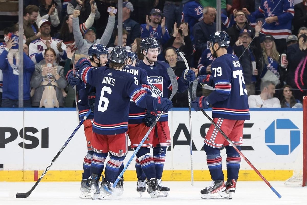 Mar 17, 2024; New York, New York, USA; New York Rangers left wing Alexis Lafreniere (13) celebrates his goal with teammates during the third period against the New York Islanders at Madison Square Garden.