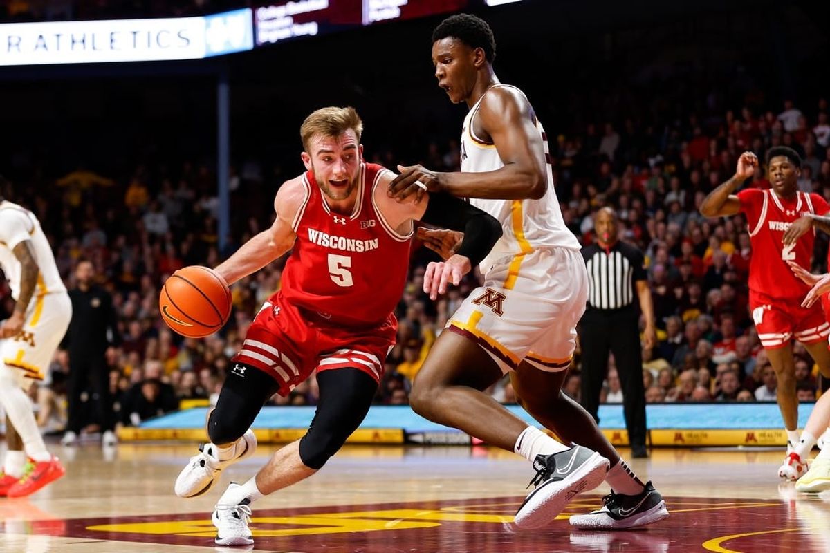 Jan 23, 2024; Minneapolis, Minnesota, USA; Wisconsin Badgers forward Tyler Wahl (5) works around Minnesota Golden Gophers forward Pharrel Payne (21) during the second half at Williams Arena.