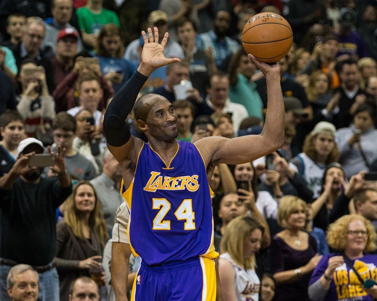 Dec 14, 2014; Minneapolis, MN, USA; Los Angeles Lakers guard Kobe Bryant (24) celebrates after surpassing Michael Jordan on the NBA All-Time Scoring List during the second quarter against the Minnesota Timberwolves at Target Center. Mandatory Credit: Brace Hemmelgarn-Imagn Images