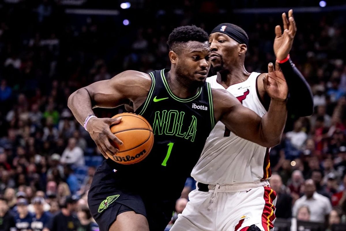 Feb 23, 2024; New Orleans, Louisiana, USA;  New Orleans Pelicans forward Zion Williamson (1) drives to the basket against Miami Heat center Bam Adebayo (13) during the second half at Smoothie King Center.