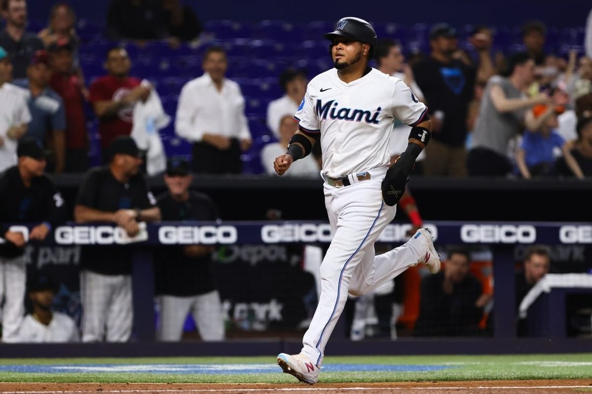 May 1, 2024; Miami, Florida, USA; Miami Marlins second baseman Luis Arraez (3) scores against the Colorado Rockies during the fifth inning at loanDepot Park.
