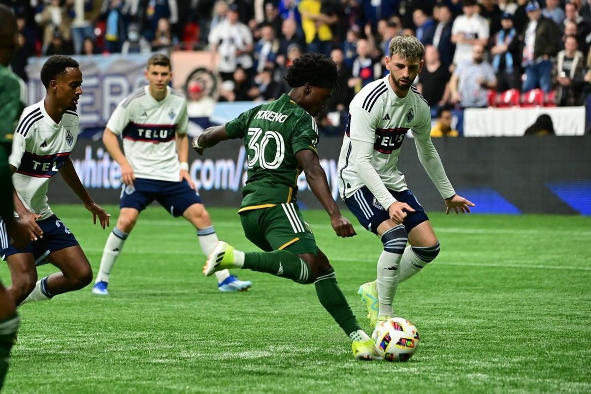 Mar 30, 2024; Vancouver, British Columbia, CAN; Portland Timbers forward Santiago Moreno (30) shoots as Vancouver Whitecaps FC defender Tristan Blackmon (6) defends during the first half at BC Place.