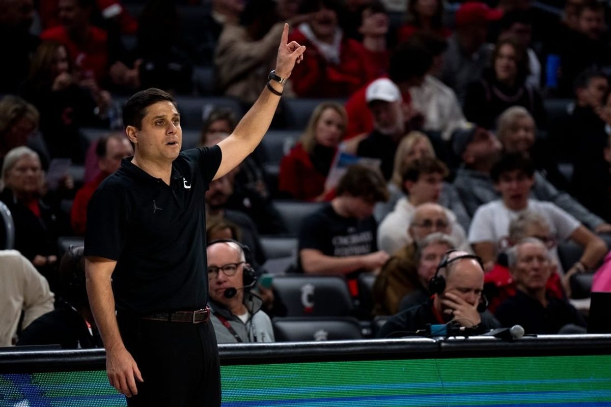 Cincinnati Bearcats head coach Wes Miller speaks to his players in the first half of the NCAA basketball game between the Cincinnati Bearcats and the Northern Kentucky Norse at Fifth Third Arena in Cincinnati on Sunday, Nov. 19, 2023.