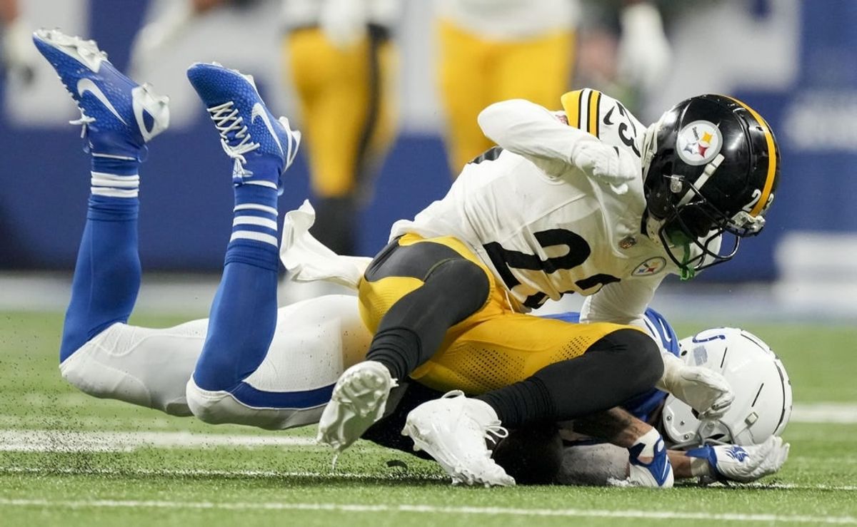 Dec 16, 2023; Indianapolis, Indiana, USA; Indianapolis Colts wide receiver Michael Pittman Jr. (11) collides with Pittsburgh Steelers safety Damontae Kazee (23) during a game against the Pittsburgh Steelers at Lucas Oil Stadium.