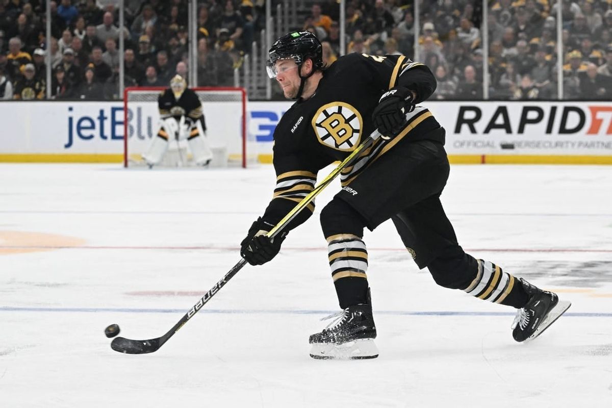 Feb 10, 2024; Boston, Massachusetts, USA; Boston Bruins defenseman Brandon Carlo (25) takes a shot against the Washington Capitals during the third period at the TD Garden.