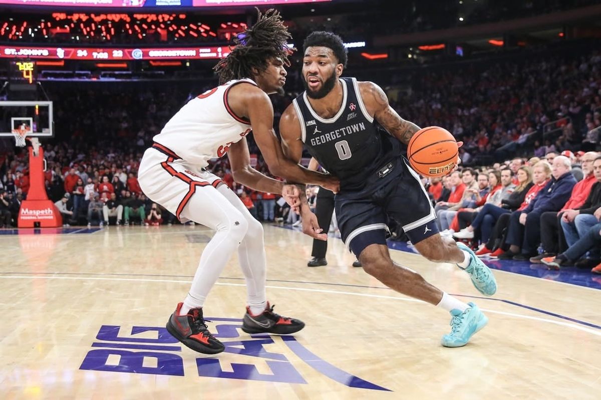 Mar 9, 2024; New York, New York, USA;  Georgetown Hoyas guard Dontrez Styles (0) looks to drive past St. John's Red Storm forward Glenn Taylor Jr. (35) in the first half at Madison Square Garden.