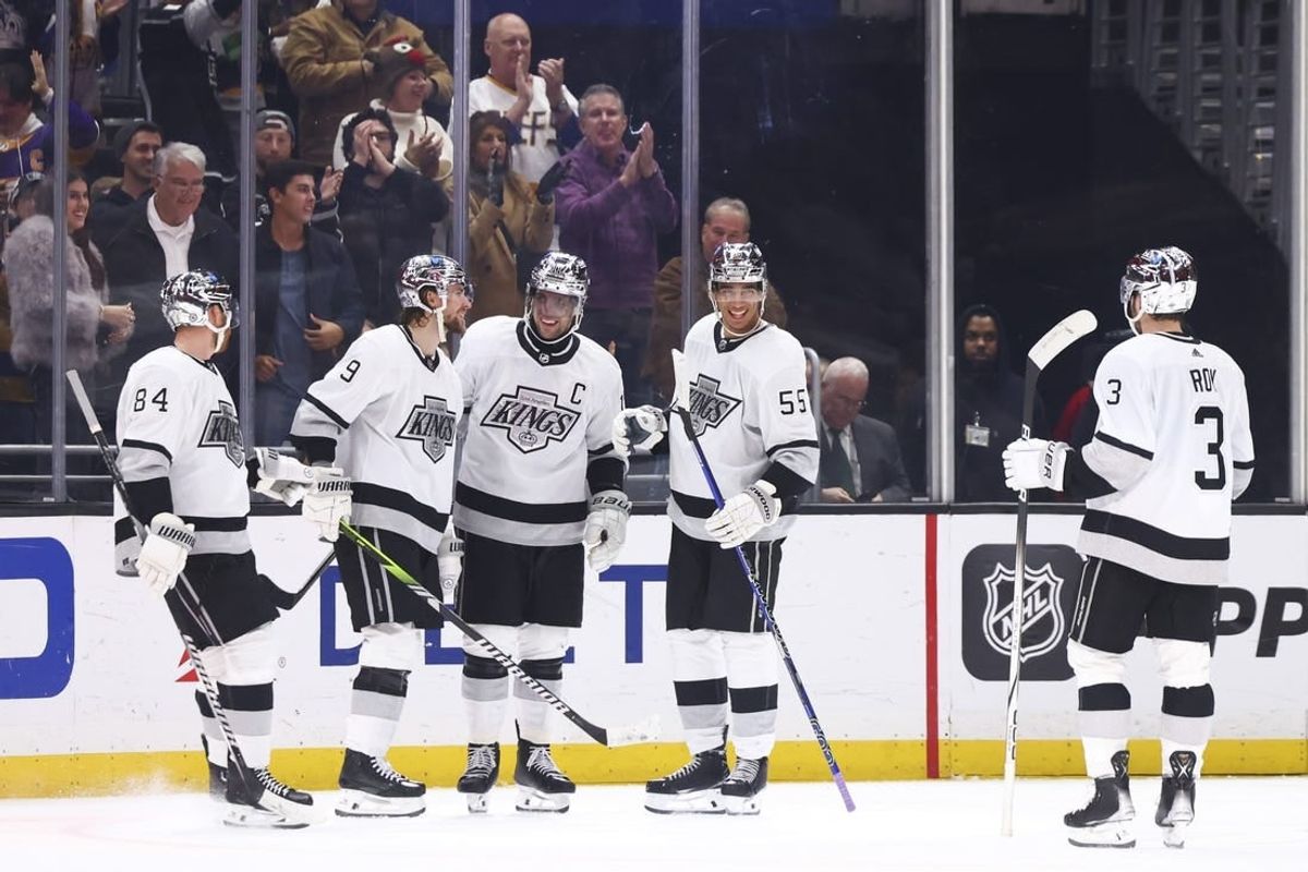 Dec 27, 2023; Los Angeles, California, USA; Los Angeles Kings right wing Adrian Kempe (9) celebrates with his teammates after scoring a goal during the third period of a game against the San Jose Sharks at Crypto.com Arena.