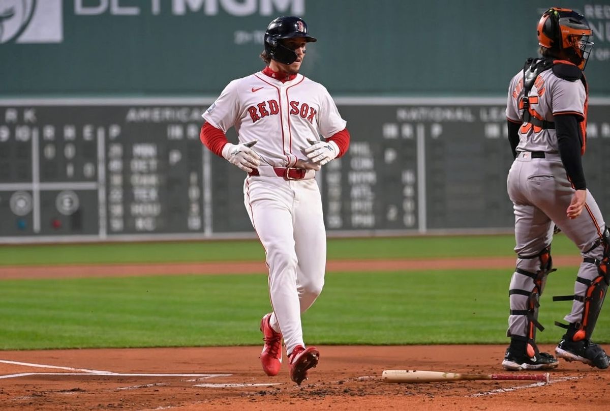Apr 11, 20024; Boston, Massachusetts, USA; Boston Red Sox center fielder Jarren Duran (16) scores a run against the Baltimore Orioles during the first inning at Fenway Park.