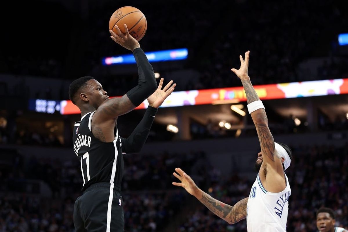 Feb 24, 2024; Minneapolis, Minnesota, USA; Brooklyn Nets guard Dennis Schroder (17) shoots as Minnesota Timberwolves guard Nickeil Alexander-Walker (9) defends during the second half at Target Center.