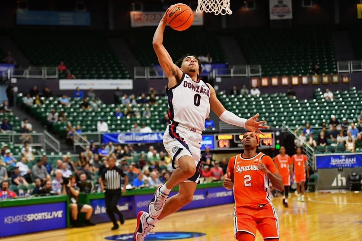 Nov 21, 2023; Honolulu, HI, USA;  Gonzaga Bulldogs guard Ryan Nembhard (0) drives to the basket as Syracuse Orange guard JJ Starling (2) looks on during the second half at SimpliFi Arena at Stan Sheriff Center.