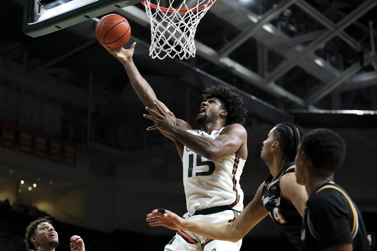 Dec 16, 2023; Coral Gables, Florida, USA; Miami Hurricanes forward Norchad Omier (15) lays up a shot against the La Salle Explorers during the second half at Watsco Center.