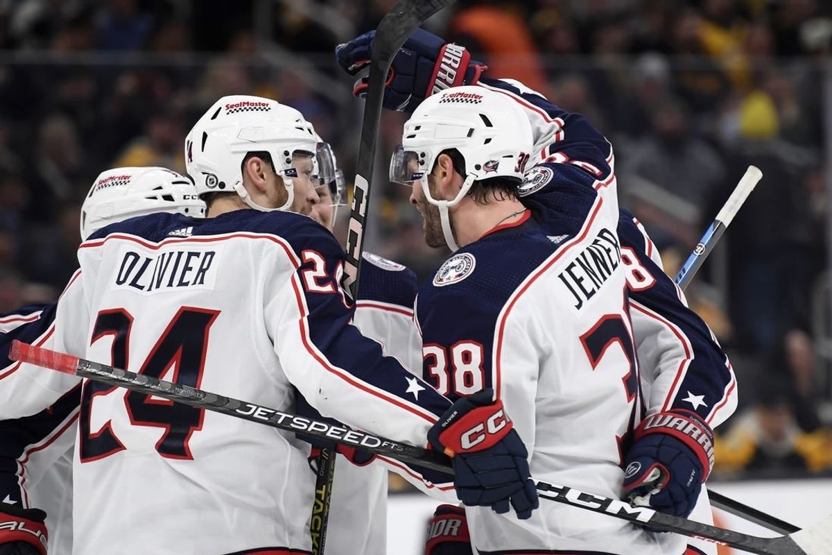 Dec 3, 2023; Boston, Massachusetts, USA; Columbus Blue Jackets center Boone Jenner (38) celebrates his goal with right wing Mathieu Olivier (24) and the rest of his line mates during the second period against the Boston Bruins at TD Garden.