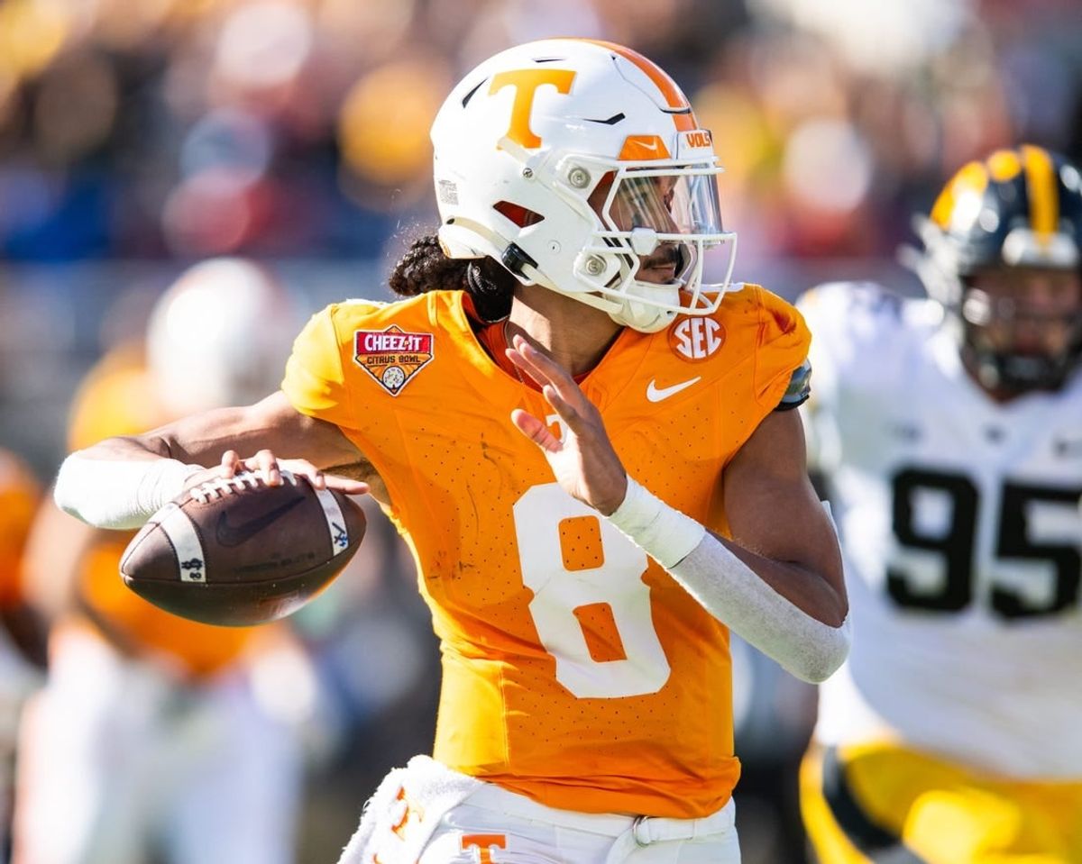 Jan 1, 2024; Orlando, FL, USA; Tennessee Volunteers quarterback Nico Iamaleava (8) throws the ball against the Iowa Hawkeyes in the second quarter at Camping World Stadium.