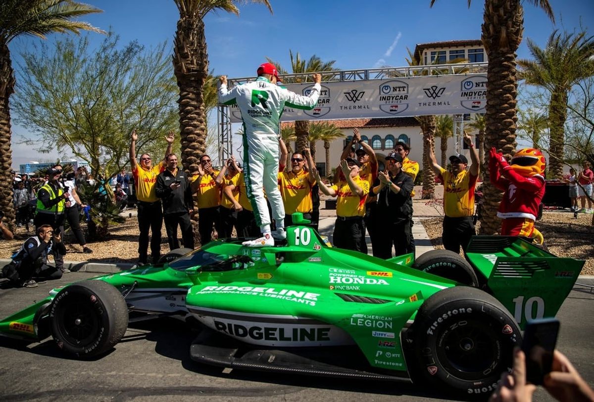 Alex Palou of Chip Ganassi Racing celebrates winning the feature race of the $1 Million Challenge with his team at The Thermal Club in Thermal, Calif., Sunday, March 24, 2024.