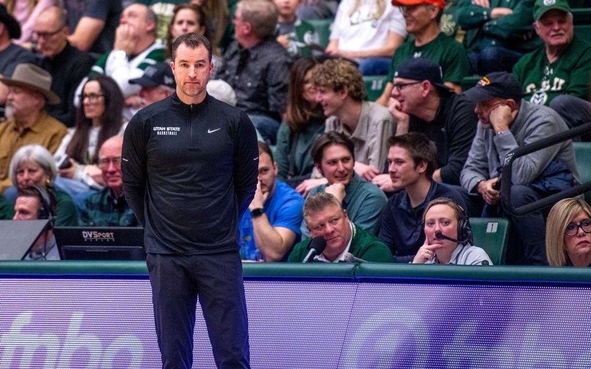Utah State basketball head coach Danny Sprinkle stares off into the distance after a turnover in a blowout loss against Colorado State at Moby Arena on Saturday, Feb. 17, 2024 in Fort Collins, Colo.