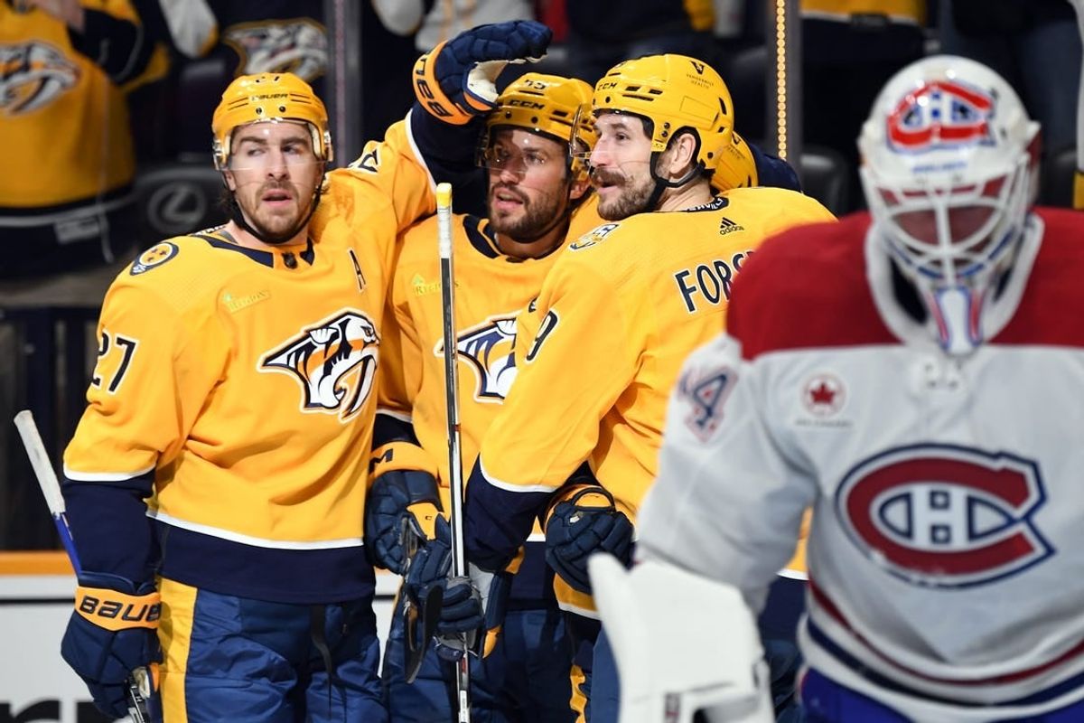 Mar 5, 2024; Nashville, Tennessee, USA; Nashville Predators left wing Filip Forsberg (9) celebrates with teammates after a goal against Montreal Canadiens goaltender Jake Allen (34) during the first period at Bridgestone Arena.
