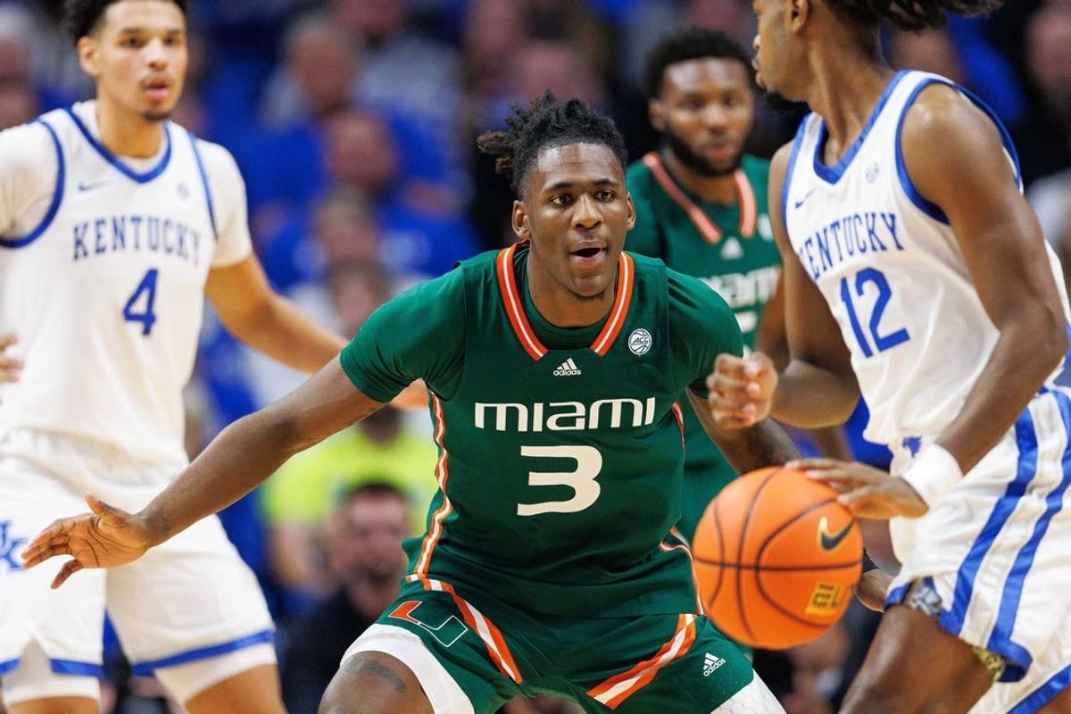 Nov 28, 2023; Lexington, Kentucky, USA; Miami (Fl) Hurricanes guard Christian Watson (3) guards Kentucky Wildcats guard Antonio Reeves (12) during the first half at Rupp Arena at Central Bank Center.