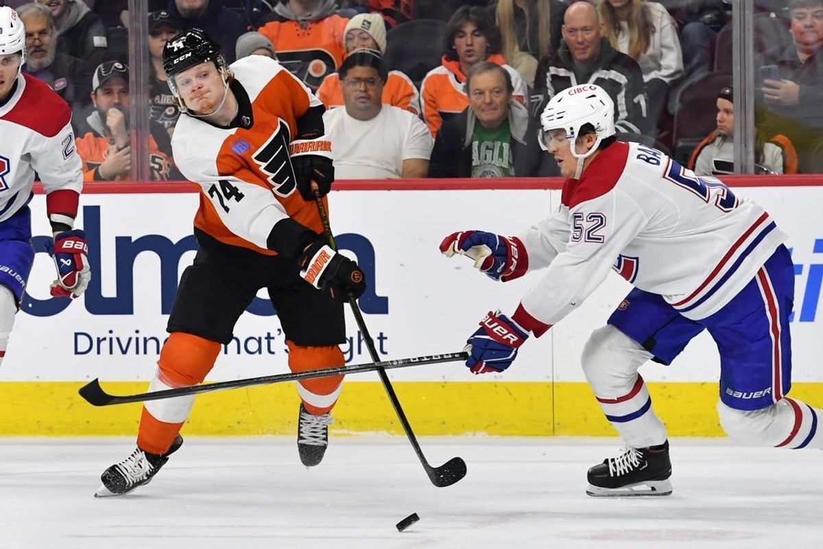 Jan 10, 2024; Philadelphia, Pennsylvania, USA; Philadelphia Flyers right wing Owen Tippett (74) takes a shot on goal against Montreal Canadiens defenseman Justin Barron (52) during third period at Wells Fargo Center.