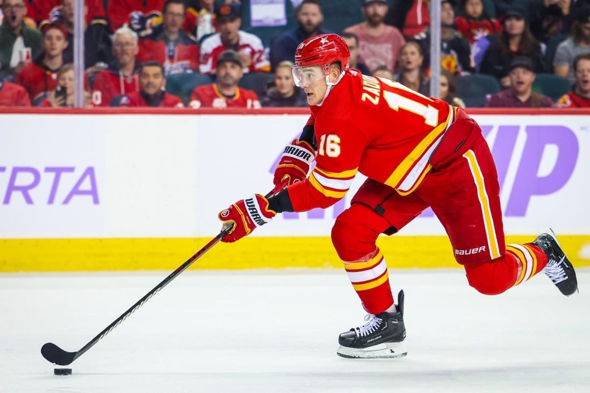 Nov 27, 2023; Calgary, Alberta, CAN; Calgary Flames defenseman Nikita Zadorov (16) skates with the puck against the Vegas Golden Knights during the second period at Scotiabank Saddledome.
