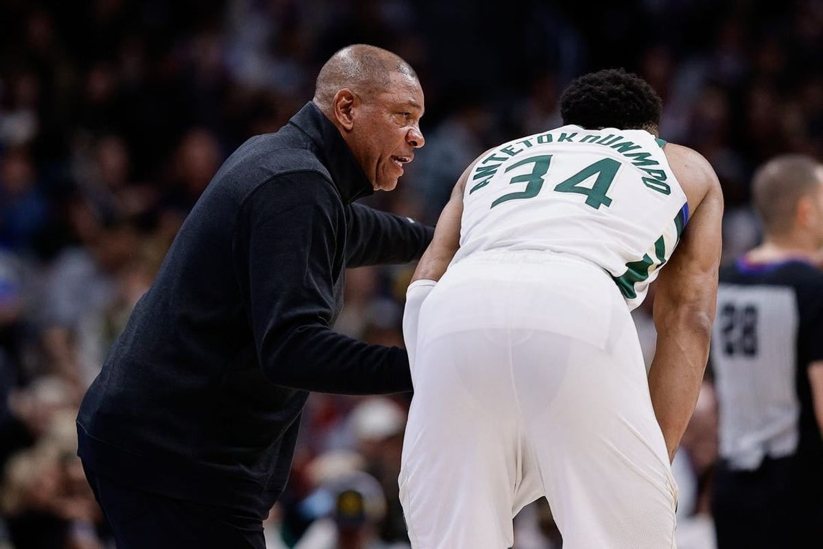 Jan 29, 2024; Denver, Colorado, USA; Milwaukee Bucks head coach Doc Rivers talks with forward Giannis Antetokounmpo (34) in the fourth quarter against the Denver Nuggets at Ball Arena.